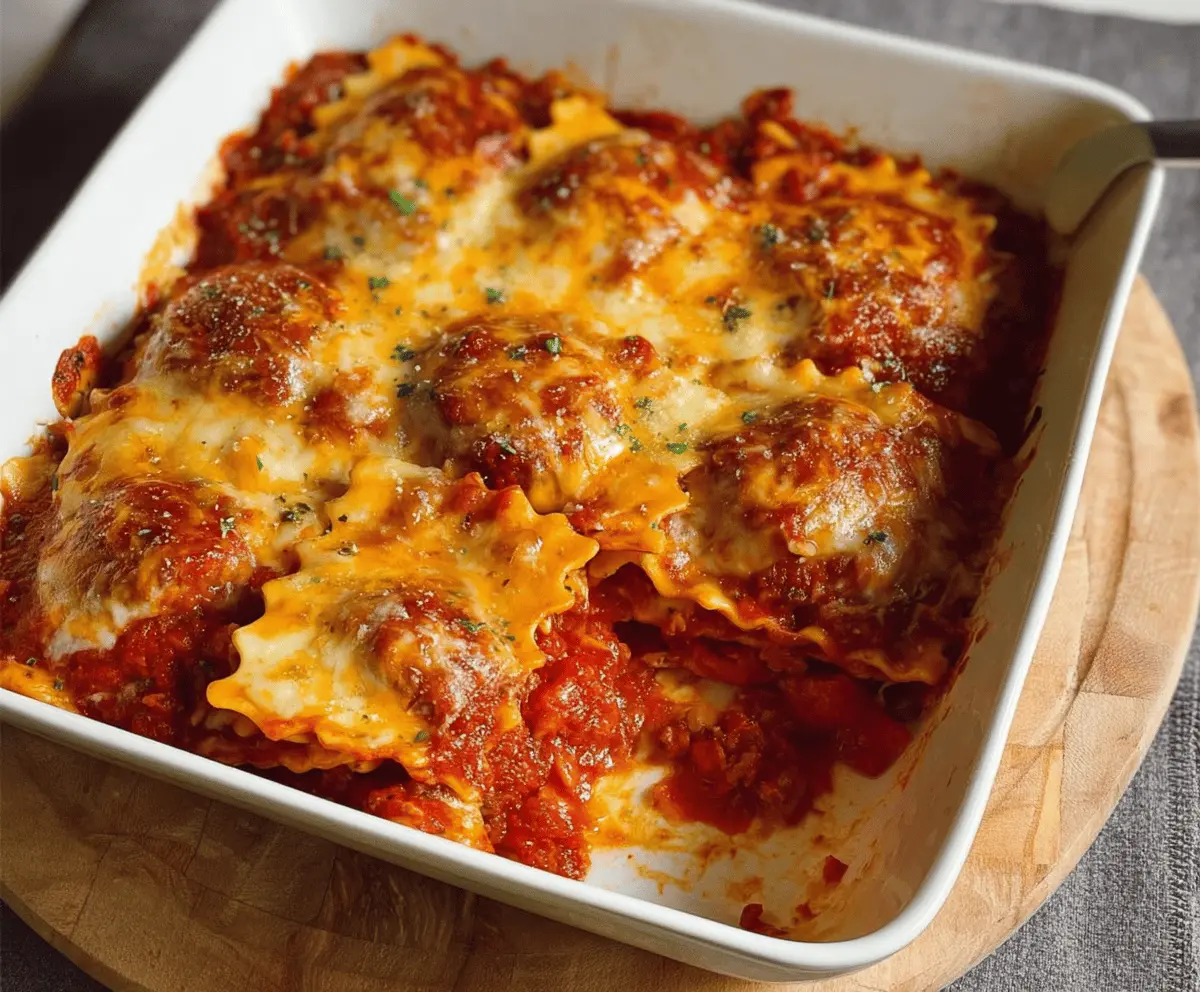 Delicious 3 Ingredient Ravioli Bake, also known as Lazy Lasagna, topped with melted cheese