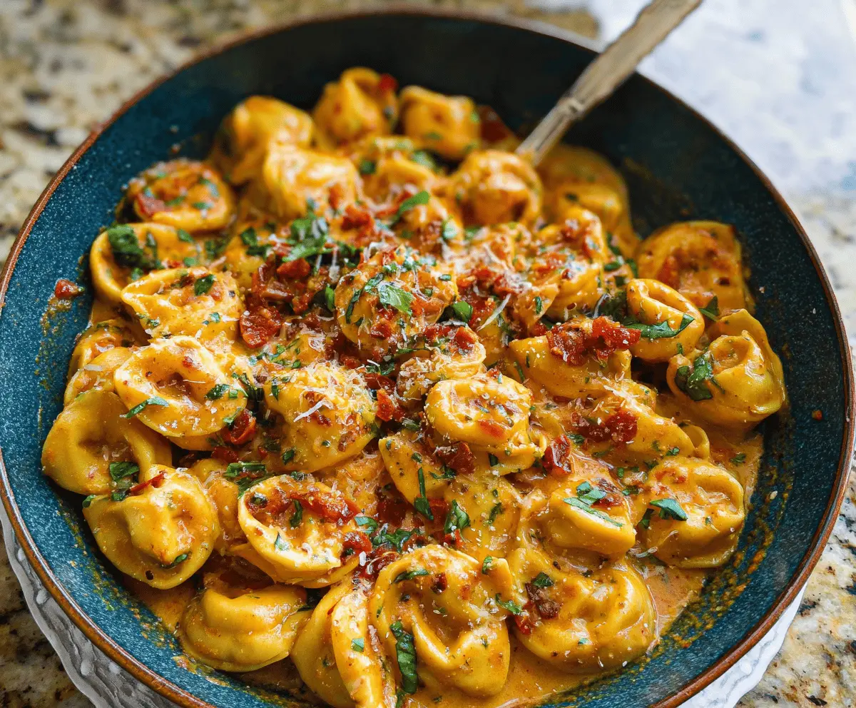 Delicious Marry Me Tortellini served with fresh herbs and creamy sauce on a stylish plate