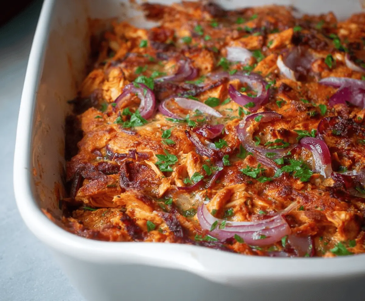 Delicious Whole30 BBQ Chicken Casserole in a baking dish with chicken, vegetables, and smoky BBQ sauce.