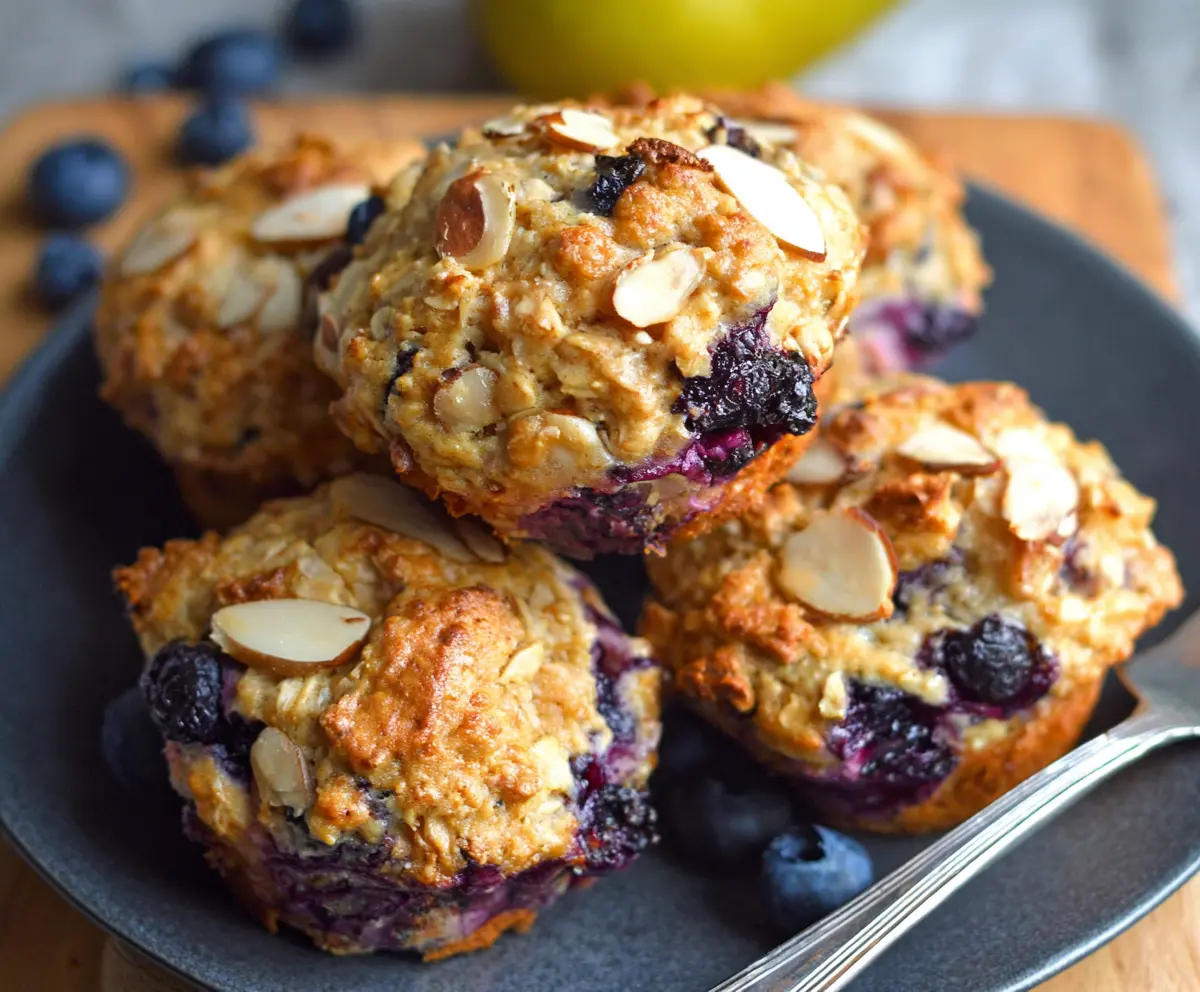 Delicious Blueberry Pear Ginger Oatmeal Muffins with fresh blueberries, ripe pears, and a hint of ginger displayed in a baking dish.