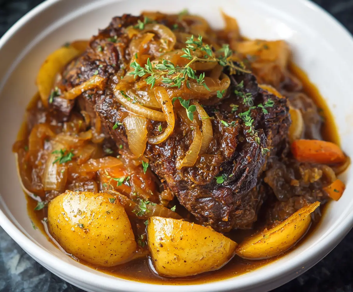 Succulent Crockpot French Onion Pot Roast with caramelized onions and tender beef, perfect for a comforting meal.
