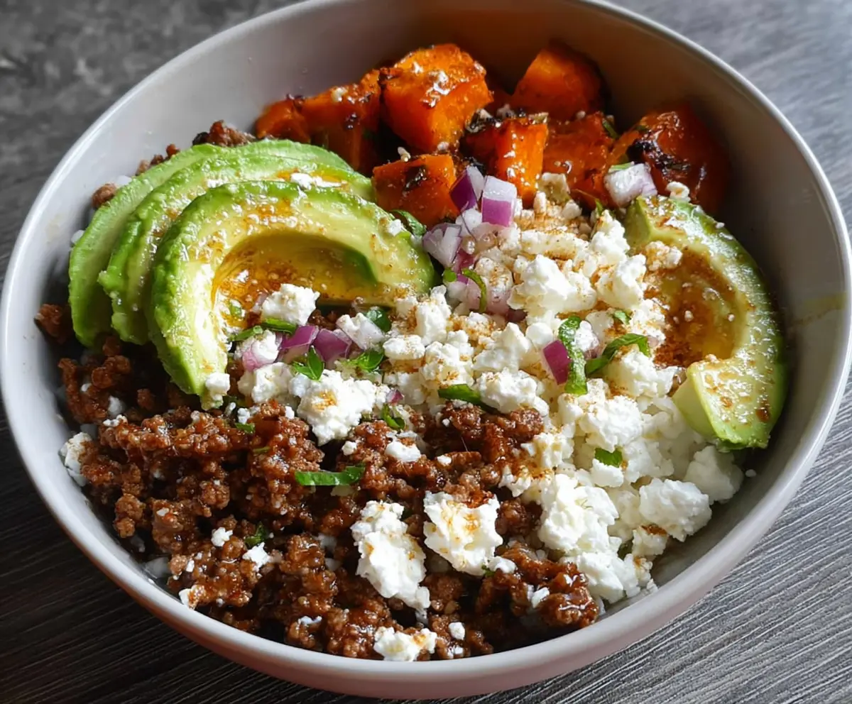 Delicious Ground Beef Power Bowl topped with fresh avocado and creamy cottage cheese, perfect for a healthy meal.